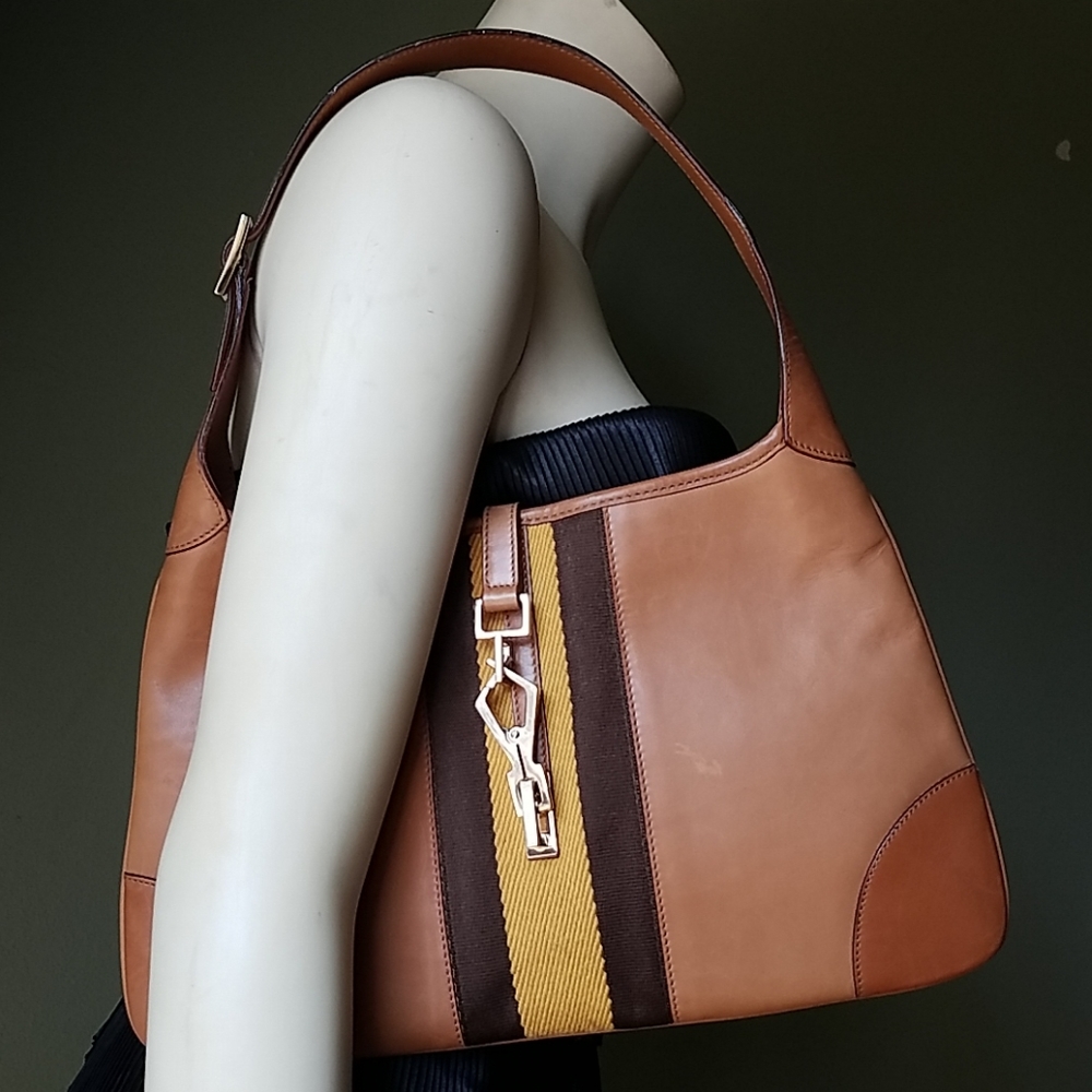 Gucci Jackie Leather hobo bag w/ metal claw clasp